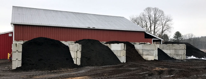 two hands holding compost